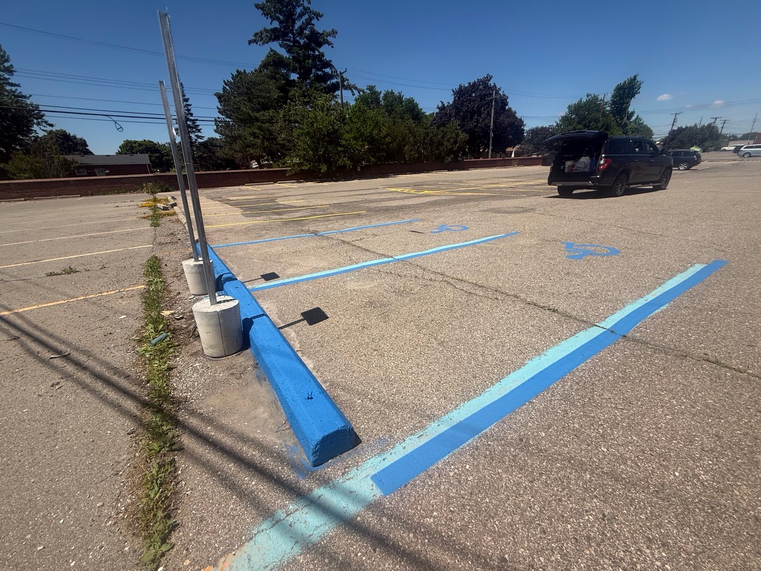 ADA handicap marking and blue curb painting